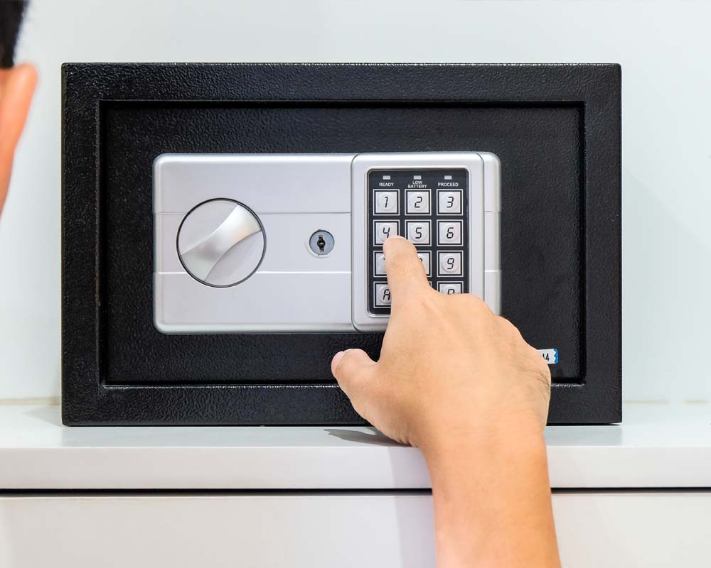 An image of a person using the safes keypad to gain entry.